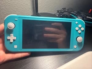 Nintendo Switch Lite Light Blue Handheld Gaming System With Charger - image 1